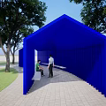Blue Pavilion Structure With Trees And Grass In Park Where Two People Are Sitting
