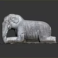 Artistic Stone Elephant Sculpture in Reclining Position on Textured Stone Base