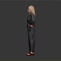Blonde Woman in Gray Blazer and Wide Leg Pants with Brown Shoes Against Gray Background