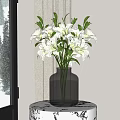 Transparent Glass Vase with White Lilies on Small Patterned Table by Window with Snowy Scenery