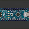 Blue Computer Circuit Board With Chip USB Port And Metal Electronic Pins