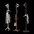 Three Wooden Coat Racks With Hats Coats And Bag In Modern Gray Wall Interior