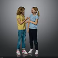 Two Happy Girls Talking And Interacting In Colorful Shirts And Pants On Gray Background