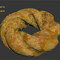 Golden Orange Ring Shaped Bread With Black Sesame Seeds And Twisted Texture