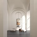 Elegant Modern Entryway Hallway With Arched Doorways White Walls Hanging Art Accent Chairs And Sunlight