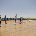 Basketball Gym With Wooden Floor Court Players Playing Basketball Game And Spectators In Blue Seating 3d model