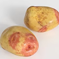 Fresh Two Yellow And Red Spotted Potatoes On White Background