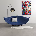 Blue Shell Shaped Single Seater Sofa With White Cushion Floor Lamp And Colorful Abstract Painting