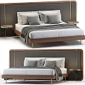 Double Bed With Gray Upholstered Headboard Wooden Frame Plush Pillows Striped Blanket And Gold Nightstands