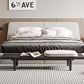 Modern Double Bed with Upholstered Headboard White Pillows Grey Bedding Footstool and Striped Rug
