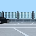 Organized Parking Lot With Multiple Parked Cars And Surrounding Fencing