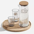 Transparent Glass Cups And Carafes Of Different Sizes On Wooden Trays For Drinking