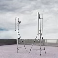 Metal Structure Industrial Equipment With Brackets And Antenna Installed On Rooftop Under Cloudy Sky