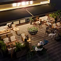 Commercial Street Outdoor Dining Space With Greenery Panda Crane Decor Cozy Seating And Ambient Lights