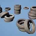 Various Stacked and Single Car Tires Arranged in Different Positions with Rubber Texture
