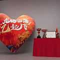 Red Themed Festival Decor Setup With Heart Shaped Props And Fu Characters Calendar