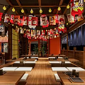 Japanese Style Restaurant Interior With Red Lanterns Daruma Decorations Wooden Tables and Chairs