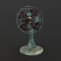 Vintage Electric Fan with Metal Cage Worn Green Base and Retro Design