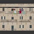 Three Story Building Model With Weathered Beige Exterior Dark Stains And Balconies Hanging Colored Clothes