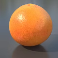 Fresh Ripe Grapefruit With Bright Orange Smooth Textured Skin On Gray Background