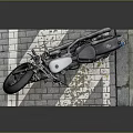 Classic Silver and Black Motorcycle with Large Tires on Brick Platform
