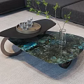 Modern Coffee Table With Blue Marble Top Black Tray Glasses Green Plant And Gray Sofa