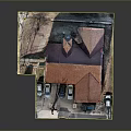Small Stone Building With Red Roof And Parking Lot With Cars And Tree