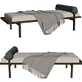 Modern Ottoman With Upholstered Cushion Wooden Legs Gray Fringed Blanket And Blue Roller Pillow