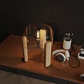 Vintage Wooden Table Lamp with Edison Bulb on Desk Featuring Pencils Headphones and Phone