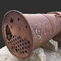 Rusted Old Fireplace With Holes On Stone Blocks And Moss Growth