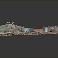 Desert Industrial Facility Aerial View With Two Large Cylindrical Tanks Vehicles Small Buildings and Vegetation
