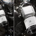 Elegant Transparent Perfume Bottle On Dark Wet Stones With Water Drops