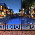 Modern Commercial Street Night Scene With Water Pool Wooden Railing Lit Shops And Palm Trees