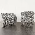 Modern Coffee Table With Gray Tabletop And Metallic Cylindrical Decorations Having Intricate Bead Detailing