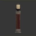 Elegant Candle Holder With Red Wooden Column And Metal Accents Holding Lit Candle