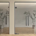 Modern Glass Hinged Doors with Metal Frames Silver Handles and Indoor Plants