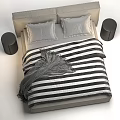 Double Bed With Beige Headboard Black And White Striped Quilt Pillows And Black Nightstand