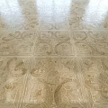 Intricate Patterned Wooden Floor Design With Natural Wood And Decorative Motifs