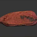 Red Cocoa Pod With Textured Surface And Dark Spots On Black Background