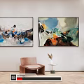 Abstract Paintings On Wall With Brown Chair Small Table And Green Plant