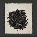 Heap of Whole Black Peppercorns Placed On White Paper Against Gray Background