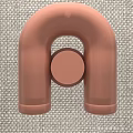Modern Rose Gold Wall Lamp With U Shaped Design And Circular Element On Fabric Background