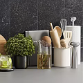 Modern Kitchen Utensils Display With Spice Oil Bottles Wooden Cutting Board And Fresh Herbs