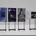 Multiple Televisions on Wheeled Stands Displaying Various Screen Contents and Media