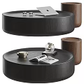 Modern Round Black Wooden Coffee Table With Open Magazine And Decorative Candle Holder