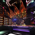 Modern Bar Interior With Neon Lights Purple And Red Lighting And Sofa Seating