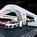 Modern Audi Car Showroom Featuring White R8 Sports Car and Red Vehicles