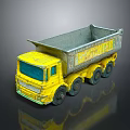 Yellow Toy Construction Truck With Open Bed And Black Wheels