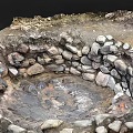 Natural Circular Stone Enclosed Depression With Muddy Ground And Water Puddles