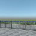 Metal Fence With Wooden Deck And Green Grass Under Blue Sky